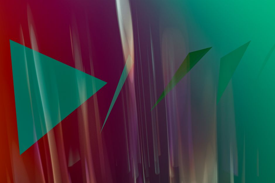 Fondo abstracto vibrante con formas geométricas y colores dinámicos.