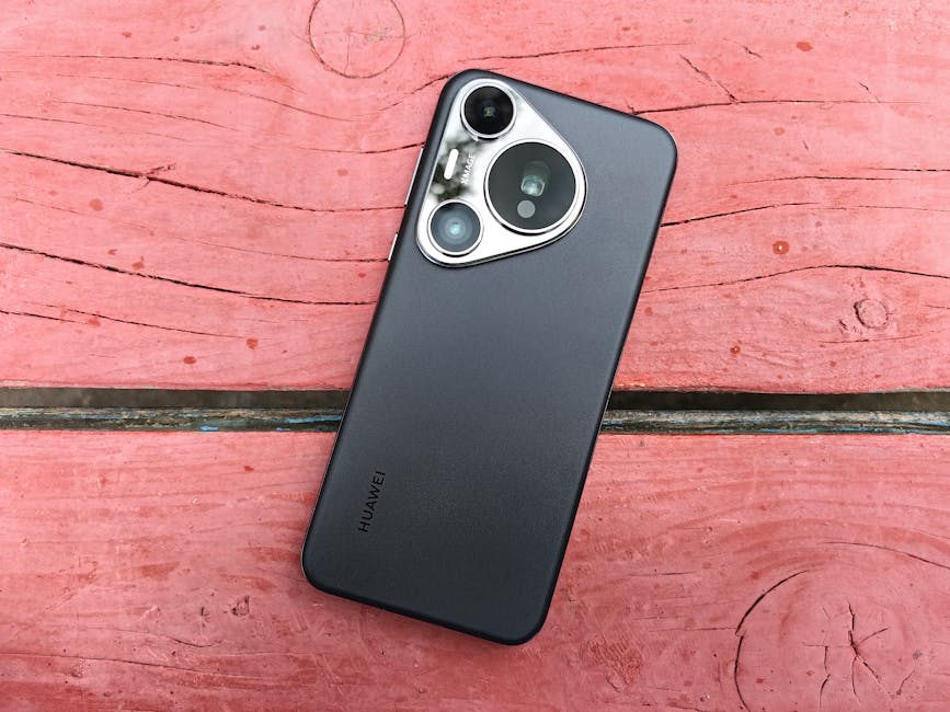 Un elegante teléfono inteligente colocado sobre una rústica mesa de madera rosa, que muestra elegancia tecnológica.