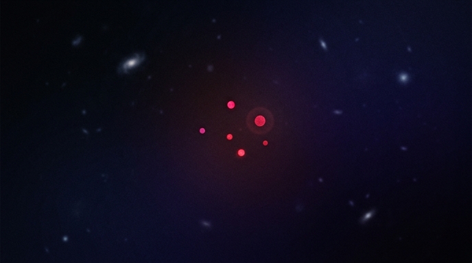 Pequeños puntos rojos brillando intensamente en la profunda y oscura inmensidad del espacio.