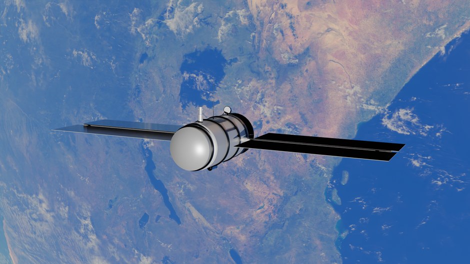 Un satélite orbita la Tierra, mostrando un impresionante océano azul y continentes desde el espacio.