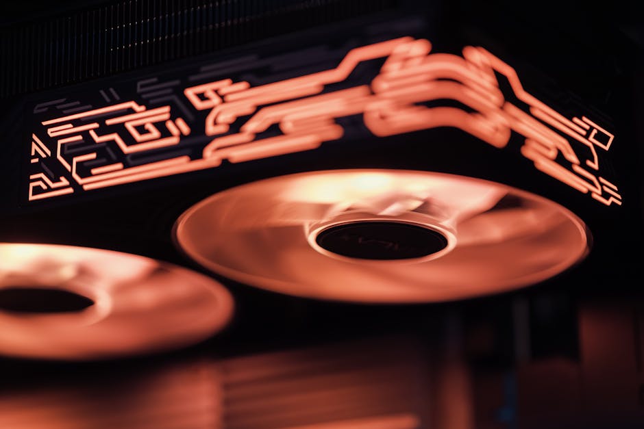 Una vista detallada de los ventiladores de refrigeración de ordenador iluminados con intrincados patrones, que muestran el diseño tecnológico.