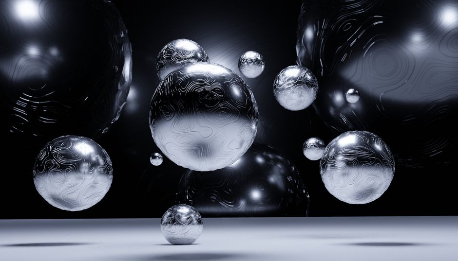 Una visualización abstracta 3D de bolas de plata flotantes con texturas complejas y sombras.